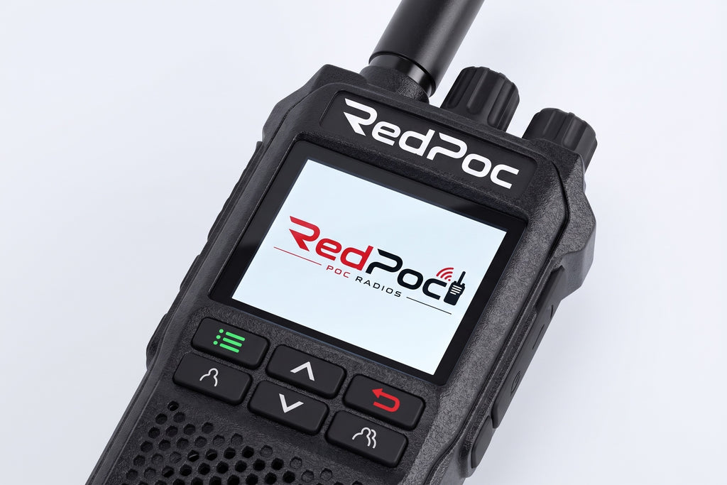 A close-up of a RedPoc handheld radio device with its screen on, displaying the RedPoc logo. The device is black with a textured grip, side knobs, and control buttons on a clean white background.